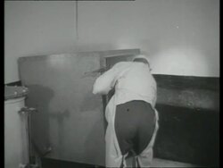 Milking parlour utensils sterilised by steam in electrical heated sterilising chest, UK  1939 Stock Footage