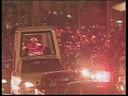 Pope drives through streets lined with faithful to stadium for youth rally News Clip