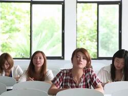 Female students studying in the classroom Stock Footage