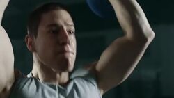 Focused male athlete doing exercise with kettlebell at gym Stock Footage