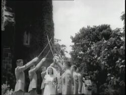 A couple kisses after their wedding at the Cadet Chapel in West Point. News Clip