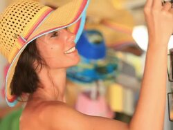 Good Looking young woman smiles as she shops on holiday Stock Footage