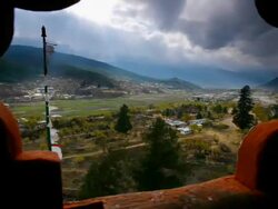 T/L, WS, clouds and light passing over valley framed through window of Paro Dzong / Paro, Bhutan Stock Footage
