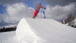 Snowboarder performs a trick Stock Footage
