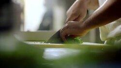 Skilled chef mince cuts parsley in restaurant kitchen Stock Footage