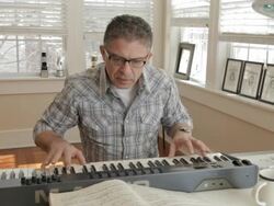 Mixed race man playing keyboard Stock Footage