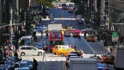 Traffic and pedestrians move through busy intersections on 42nd Street in Midtown Manhattan. Stock Footage