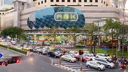 HD Time lapse : Traffic jam at MBK shopping center Bangkok Thailand Stock Footage