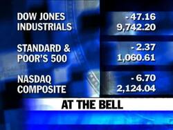A surprise drop in consumer confidence tripped up investors, a day after two corporate takeovers set off a steep market rally. News Clip