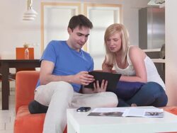 HD DOLLY: Young Couple Using Digital Tablet Stock Footage