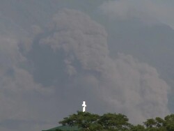 Volcanic eruption causes pyroclastic flow and ash cloud to drift over town, Philippines, Dec 2009 Stock Footage