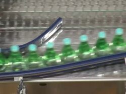 CU Shot of bottle moving in bottling plant at beverage industry / Gerolstein, Rhineland Palatinate, Germany  Stock Footage