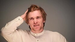 young adult man  thinks and it comes to mind the idea Stock Footage