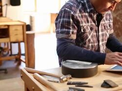 Native American artist using digital tablet in his art studio Stock Footage