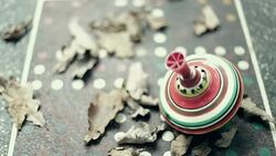 Spinning Top, Concrete table, Leafs Stock Footage