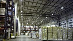 Cardboard boxes and shelves in distribution warehouse Stock Footage