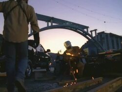 WS PAN Man arc welding next to truck beside construction bridge at Hoover dam / Boulder City, Nevada, USA Stock Footage