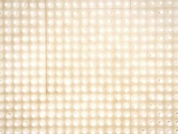 Man with megaphone in front of lightwall Stock Footage