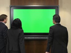 Business Professionals in Front of Chroma Key Monitor Stock Footage