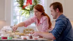 Man arranges strips of dough as woman bastes lattice-top pie (dolly-shot) Stock Footage