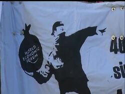 Anti-globalization protesters marched on Saturday through the center of the Swiss town of Davos, where the World Economic Forum is being held.  Dozens of protesters carried banners calling for the overthrow of global capitalism. News Clip