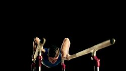 SLO MO Gymnast doing a routine on parallel bars Stock Footage