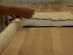 MS Baker makes cinnamon buns, close up / Copenhagen, Seeland, Denmark    Stock Footage