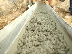 Cement Mixer Trough at a Construction Site Stock Footage