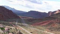 elevated view of traffic on US191 ib sunner outside Moab Utah Stock Footage