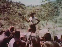 Commanding officer talks to soldiers during Vietnam War Stock Footage