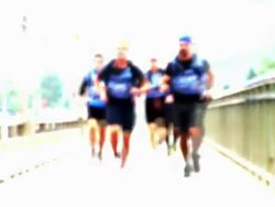 HD LOOP: Runners On The Bridge Stock Footage