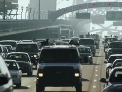 Multiple lanes of commuter traffic congestion drive toward camera on the Ben Franklin Bridge. Stock Footage