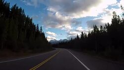 POV from car as it dives along mountain road Stock Footage