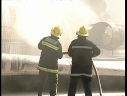 MS zooming out to WA, Airport fire fighters hosing fuselage of plane with foam Stock Footage