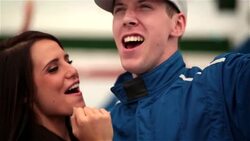 Proud woman and race-car driver cheer, blue racing team celebrates victory Stock Footage