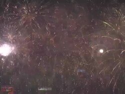 Fireworks explode in grand finale over Hong Kong's Victoria Harbour, from Tsim Sha Tsui, Kowloon, East Asian Games Opening Ceremony Fireworks Display, December 2009 Stock Footage