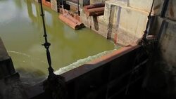 Flowing water at floodgate,Tilt Down Stock Footage