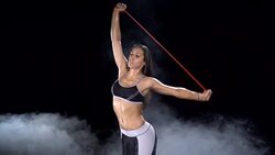 Stretching up with a resistance band Stock Footage