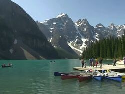 MS People enjoying on small boat harbour at Moraine Lake in ten peaks valley at nationalpark / Lake Louise, Alberta, Canada Stock Footage