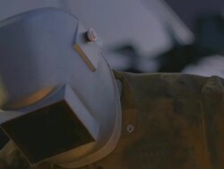 CU Man arc welding next to truck / Boulder City, Nevada, USA Stock Footage