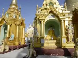 MS PAN Shot of golden shrines with nat figures in shwedagon pagoda / Yangon, Yangon Division, Myanmar Stock Footage