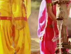 Three young women playing with water near handpump, Haryana, India Stock Footage