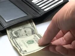 Placing money in wallet Stock Footage