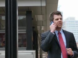 MS Well dressed young man using cellular device in downtown urban area next to commuter train / Minneapolis, Minnesota, United States Stock Footage