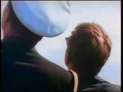1960s close up REAR VIEW John Kennedy + naval officer looking up, watching missile / newsreel Stock Footage