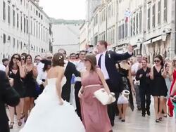 MS View of Merry wedding congregation moving through streets of Dubrovnik  / Dubrovnik, Dubrovnik-Neretva, Croatia Stock Footage