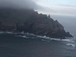 MS AERIAL Shot of light house at cloudy Cape Point / Cape Town, Western Cape, South Africa Stock Footage