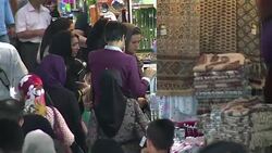 VOICED : Tehran bazaar blends hope caution a year after nuclear deal News Clip