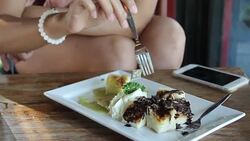 Hand of a women eating chocolate bread. Stock Footage