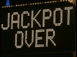 Full frame neon sign reads 'Jackpot Over' & 'Half a Million Dollars', Las Vegas Stock Footage